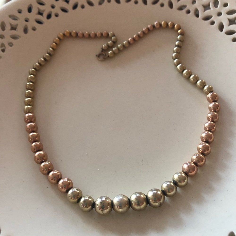 COPY - 18” long graduated gold filled beads strung on a thin gold filled chain.